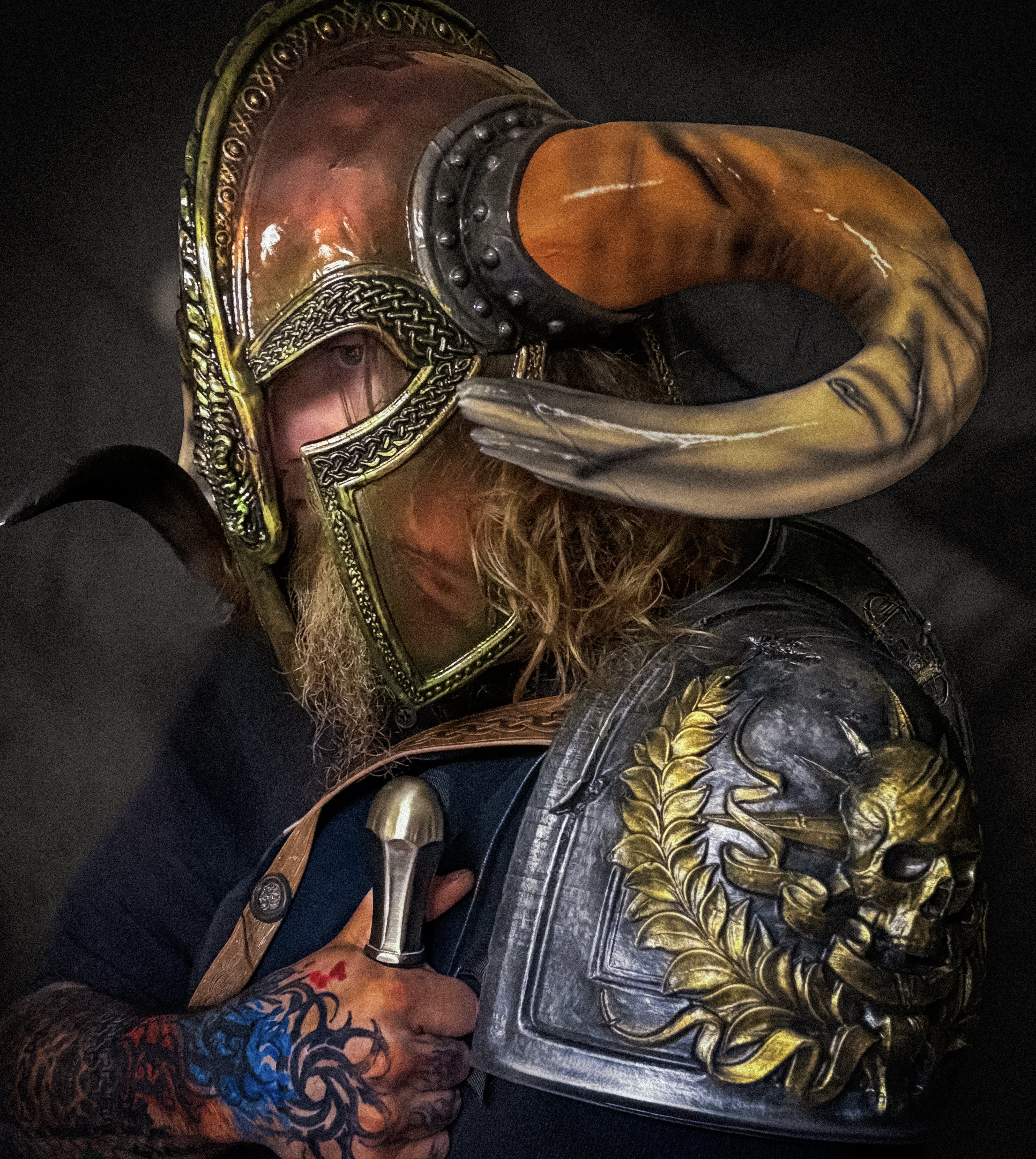 Viking helmet worn by performer under green stage light