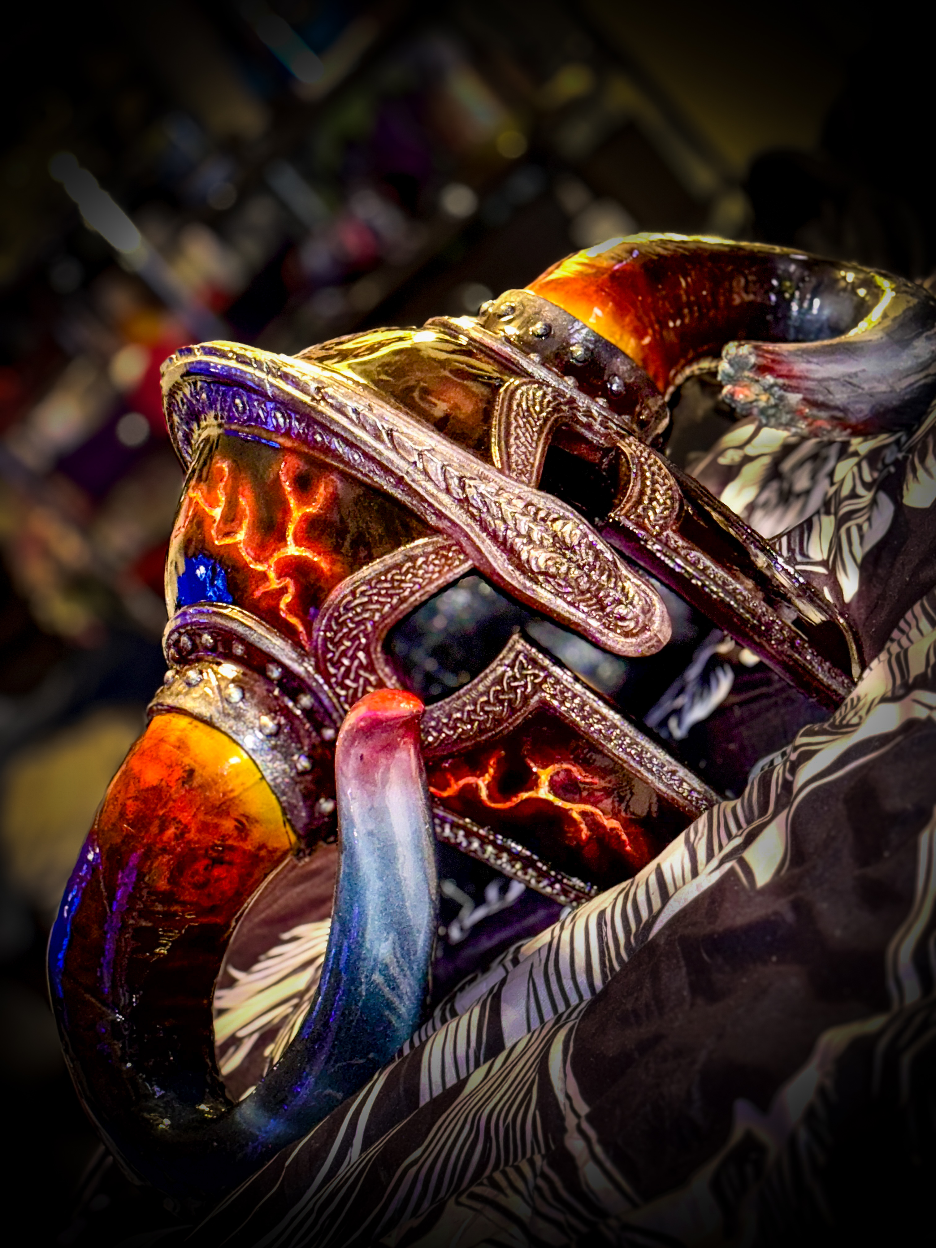 Viking helmet worn by performer under purple stage light