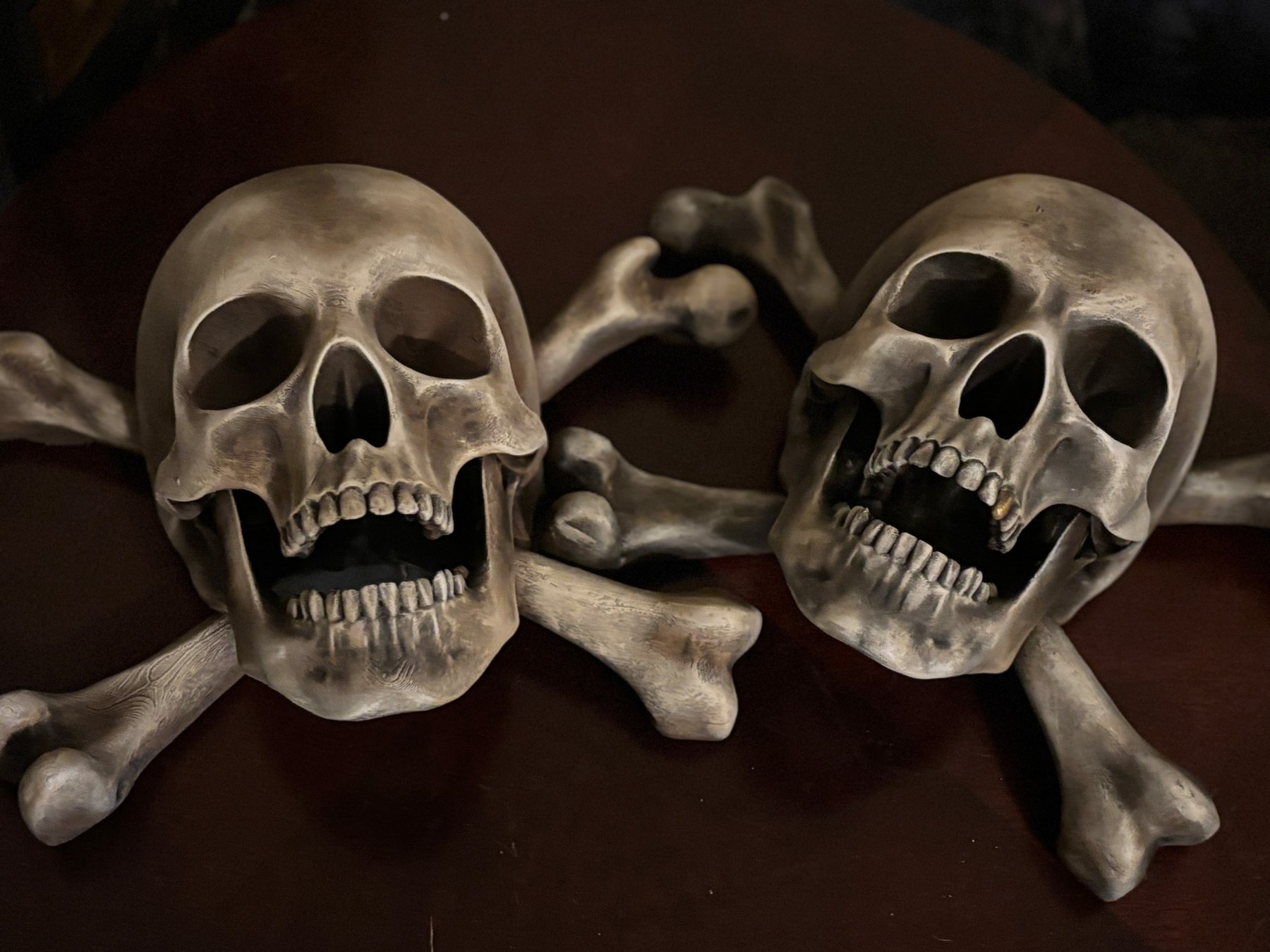 Pair of Jolly Roger skull and crossbones wall relics